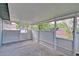 An enclosed patio with screening offering a view of the surrounding landscaping at 2516 Albury Ave, Deltona, FL 32738
