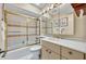 Bathroom featuring a shower-tub combo with a sleek glass enclosure and ample vanity at 264 Balfour Dr, Winter Park, FL 32792