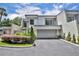 Charming home featuring a two-car garage and beautifully landscaped front yard at 264 Balfour Dr, Winter Park, FL 32792