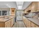 Eat-in kitchen showing tile floors, door to outside, and stainless appliances at 264 Balfour Dr, Winter Park, FL 32792