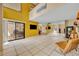 Bright and open floor plan with high ceilings, tile flooring, and sliding glass doors to outdoor patio at 264 Balfour Dr, Winter Park, FL 32792