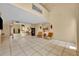 Bright living room with tile floor and accent mirrors for an open spacious feel at 264 Balfour Dr, Winter Park, FL 32792
