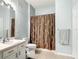 Clean bathroom with a shower-tub combination and a light-colored vanity sink area at 2781 Almaton Loop # 404, Kissimmee, FL 34747