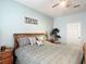 Comfortable bedroom with ceiling fan, serene colors, and matching nightstands flanking the bed at 2781 Almaton Loop # 404, Kissimmee, FL 34747