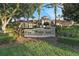 Stately clubhouse entrance with the Windsor Hills sign, lush landscaping, and elegant architecture at 2781 Almaton Loop # 404, Kissimmee, FL 34747