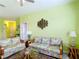 Inviting living room featuring tropical sofas, glass tables, and open space for comfortable gatherings at 2781 Almaton Loop # 404, Kissimmee, FL 34747