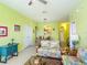 Bright living room with tile floors and tropical themed furnishings open to the kitchen and dining areas at 2781 Almaton Loop # 404, Kissimmee, FL 34747