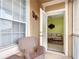 A cozy patio with wicker furniture leads into a sun-filled living room with a bright interior at 2781 Almaton Loop # 404, Kissimmee, FL 34747