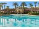 Inviting community pool featuring a spacious deck, comfortable seating, and a covered pavilion at 2781 Almaton Loop # 404, Kissimmee, FL 34747