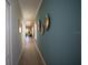 A beautifully styled hallway with wood floors and striking wall decor at 2791 San Marco Way, Winter Haven, FL 33884