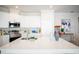 Bright kitchen featuring a large island, stainless steel appliances, and white cabinetry at 2791 San Marco Way, Winter Haven, FL 33884