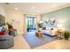 Inviting living room with a blue area rug, comfortable seating, and a view of the lanai at 2791 San Marco Way, Winter Haven, FL 33884