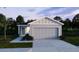 Charming one-story home with a manicured lawn and an attached two-car garage at 2795 San Marco Way, Winter Haven, FL 33884