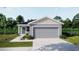 Charming one-story home with a manicured lawn and an attached two-car garage at 2795 San Marco Way, Winter Haven, FL 33884