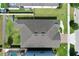 An overhead shot of the home's roof, landscaping, and proximity to neighbors at 299 Whirlaway Dr, Davenport, FL 33837