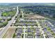 Overhead shot of a neighborhood featuring manicured lawns, community features, and easy access to nearby roads at 299 Whirlaway Dr, Davenport, FL 33837