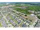 Scenic aerial view of a residential neighborhood with well-maintained lawns and easy access to highway at 299 Whirlaway Dr, Davenport, FL 33837
