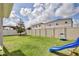 Fenced backyard features a large grassy area for activities at 299 Whirlaway Dr, Davenport, FL 33837