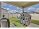 Backyard featuring play area, grill and fenced yard at 299 Whirlaway Dr, Davenport, FL 33837