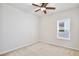 Bedroom with a ceiling fan and a window for natural light at 299 Whirlaway Dr, Davenport, FL 33837