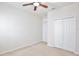 Bedroom with a ceiling fan and a large closet for storage at 299 Whirlaway Dr, Davenport, FL 33837
