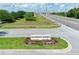 Entrance to Champions Reserve, featuring beautifully landscaped sign and easy access to nearby roadways at 299 Whirlaway Dr, Davenport, FL 33837