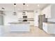 Spacious kitchen featuring granite countertops, stainless steel appliances, and modern lighting at 299 Whirlaway Dr, Davenport, FL 33837