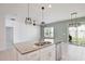Spacious kitchen with a granite island, stainless steel appliances, and an open layout at 299 Whirlaway Dr, Davenport, FL 33837
