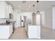Bright kitchen featuring stainless steel appliances, granite countertops, and an island with a sink at 299 Whirlaway Dr, Davenport, FL 33837