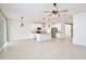 Spacious open-concept with tile flooring, a kitchen island, and stainless steel appliances at 299 Whirlaway Dr, Davenport, FL 33837