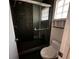 An updated bathroom with a shower and a glass block window at 3144 Ginger Cir, Orlando, FL 32826
