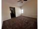Carpeted bedroom with ceiling fan and view of en-suite bathroom at 3144 Ginger Cir, Orlando, FL 32826