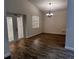 Dining room featuring tile floors, modern light fixture and french doors at 3144 Ginger Cir, Orlando, FL 32826