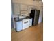 Functional kitchen features granite countertops, stainless steel refrigerator, and white appliances at 3144 Ginger Cir, Orlando, FL 32826