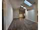 Bright living room featuring high ceilings, tile floors and skylights at 3144 Ginger Cir, Orlando, FL 32826