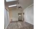 Sunlit living room with skylights and a ceiling fan at 3144 Ginger Cir, Orlando, FL 32826