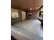 This covered patio offers an area for outdoor entertaining with two windows and a door at 3144 Ginger Cir, Orlando, FL 32826