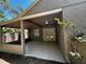 The outdoor patio features a covered area with a fan and sliding glass doors at 3144 Ginger Cir, Orlando, FL 32826