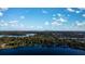 Beautiful lakefront property aerial view showcasing stunning waterfront access, mature trees and landscaping at 320 Mary Jess Rd, Orlando, FL 32839