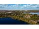 Breathtaking aerial view of the neighborhood showcasing lakes and lush green trees at 320 Mary Jess Rd, Orlando, FL 32839