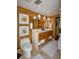Chic wood paneled bathroom featuring double sink vanity and modern fixtures at 320 Mary Jess Rd, Orlando, FL 32839