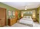 Bedroom featuring a ceiling fan, closet, and windows providing natural light at 320 Mary Jess Rd, Orlando, FL 32839