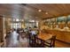 Open-concept dining room with views of the living area and the lush backyard, featuring brick flooring at 320 Mary Jess Rd, Orlando, FL 32839