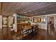 Elegant dining room with wood-paneled ceilings, terra cotta flooring, and a built-in display cabinet at 320 Mary Jess Rd, Orlando, FL 32839