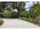 Beautiful driveway surrounded by lush greenery, enhancing the property's curb appeal at 320 Mary Jess Rd, Orlando, FL 32839