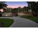 Striking stone-accented modern home with mature landscaping and inviting driveway at 320 Mary Jess Rd, Orlando, FL 32839