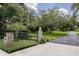 Charming front yard with a stone-accented entrance, green lawn, and a welcoming driveway at 320 Mary Jess Rd, Orlando, FL 32839