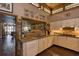 Well-lit kitchen with neutral-toned cabinetry, terracotta tile countertops and brick flooring at 320 Mary Jess Rd, Orlando, FL 32839