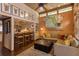 Open living room featuring wood accents, comfortable seating, and view to kitchen bar at 320 Mary Jess Rd, Orlando, FL 32839