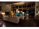 Cozy living room with a stone fireplace, large windows, and brick flooring that adds warmth at 320 Mary Jess Rd, Orlando, FL 32839